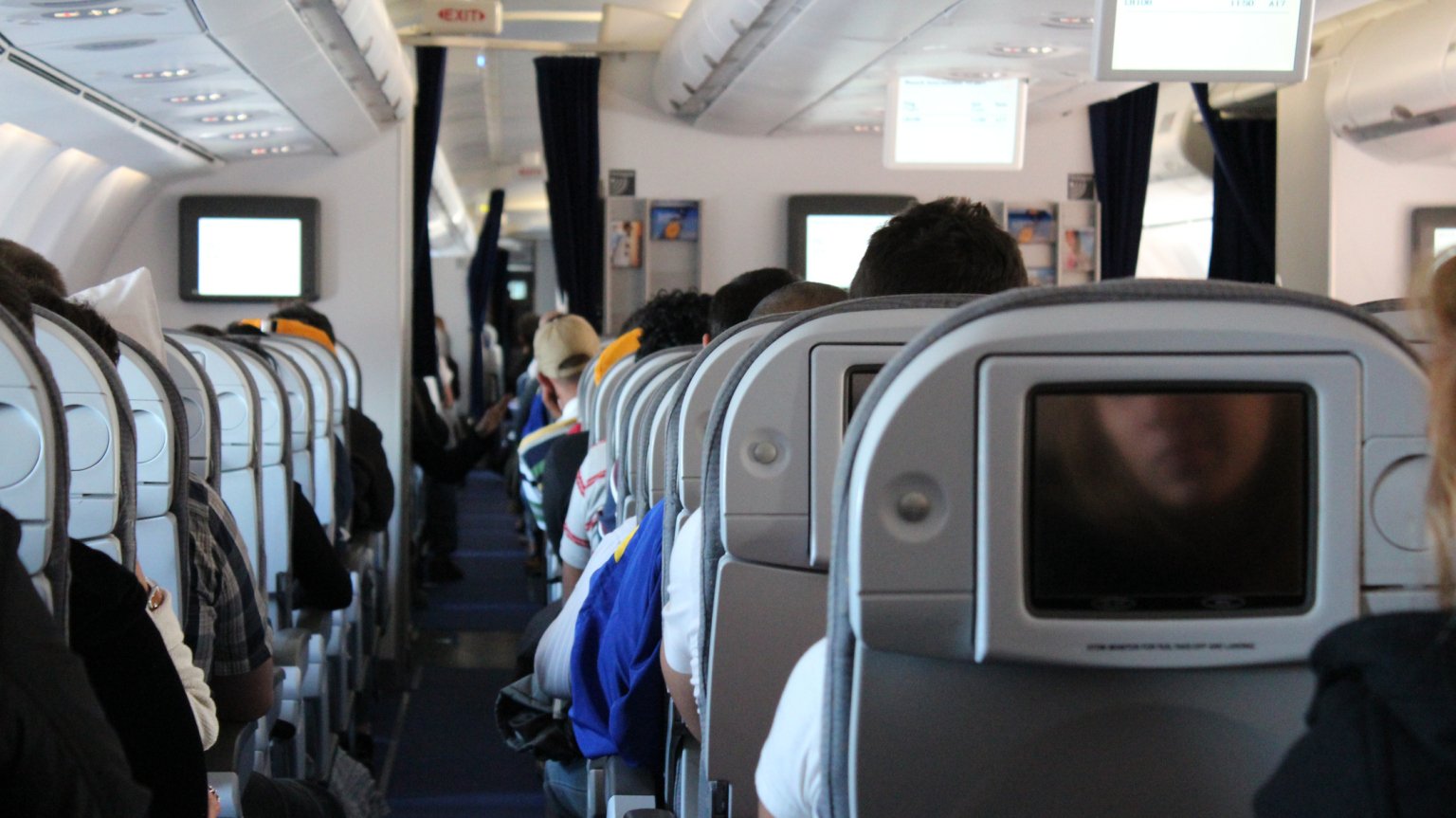 airplane waiting for take off from the perspective of an aisle seat