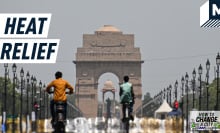 A still image showing a main road in New Delhi in the heat. Caption reads: "heat relief"