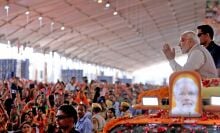 Prime Minister Narendra Modi exchanges greetings with a crowd in Jaipur.