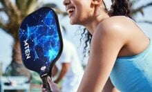 A woman plays pickleball with a MTEN pickleball paddle