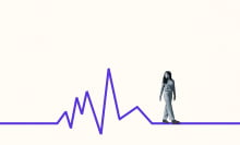 A person walks along a line that mimics a heart rate.