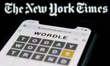 New York Times logo above Wordle on smartphone