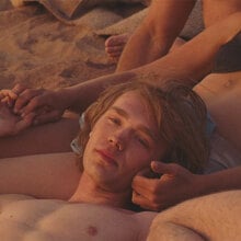 Charlie Plummer and Eve Lindley lie in the sun in "National Anthem."