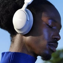 person wearing bose quietcomfort ultra headphones