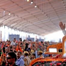 Prime Minister Narendra Modi exchanges greetings with a crowd in Jaipur.