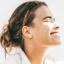 Girl smiling with visibly white teeth