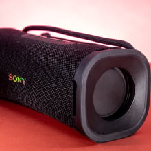 black rectangular sony speaker on red background