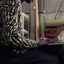 person working on m3 macbook air on their lap