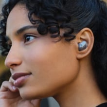 Women listening to music with wireless buds