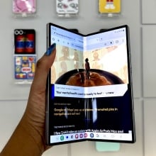 A woman holding the Samsung Galaxy Z Fold 6