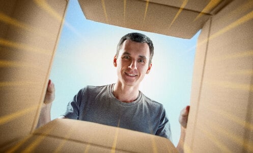 Man looking into a cardboard box