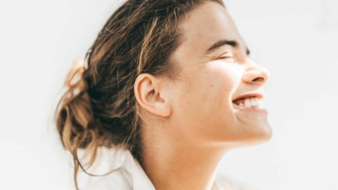 Woman smiling with white teeth.