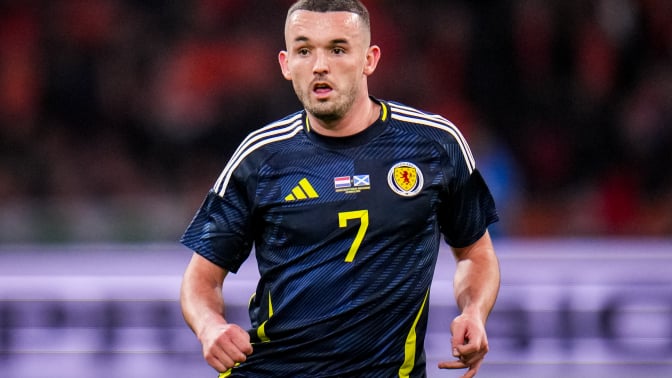 John McGinn of Scotland looks on