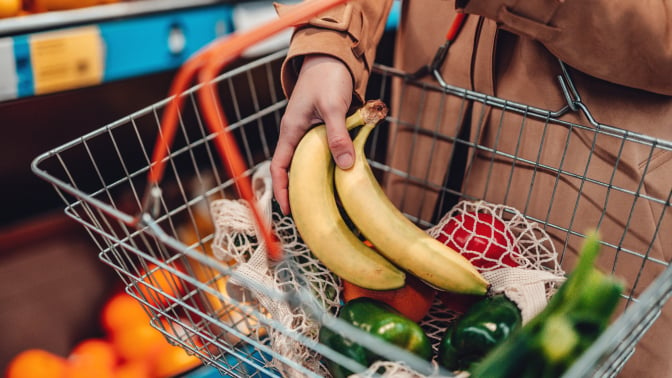 A grocery basket filled with produce.