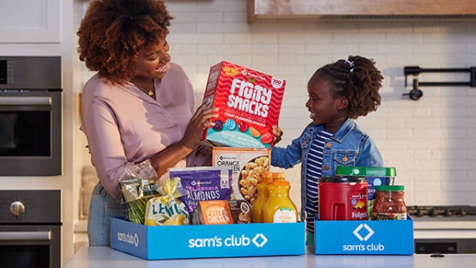 Mother and Daughter unpacking groceries