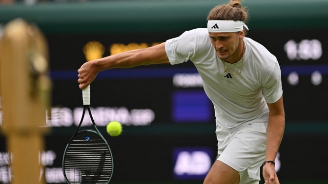 Zverev returns the ball