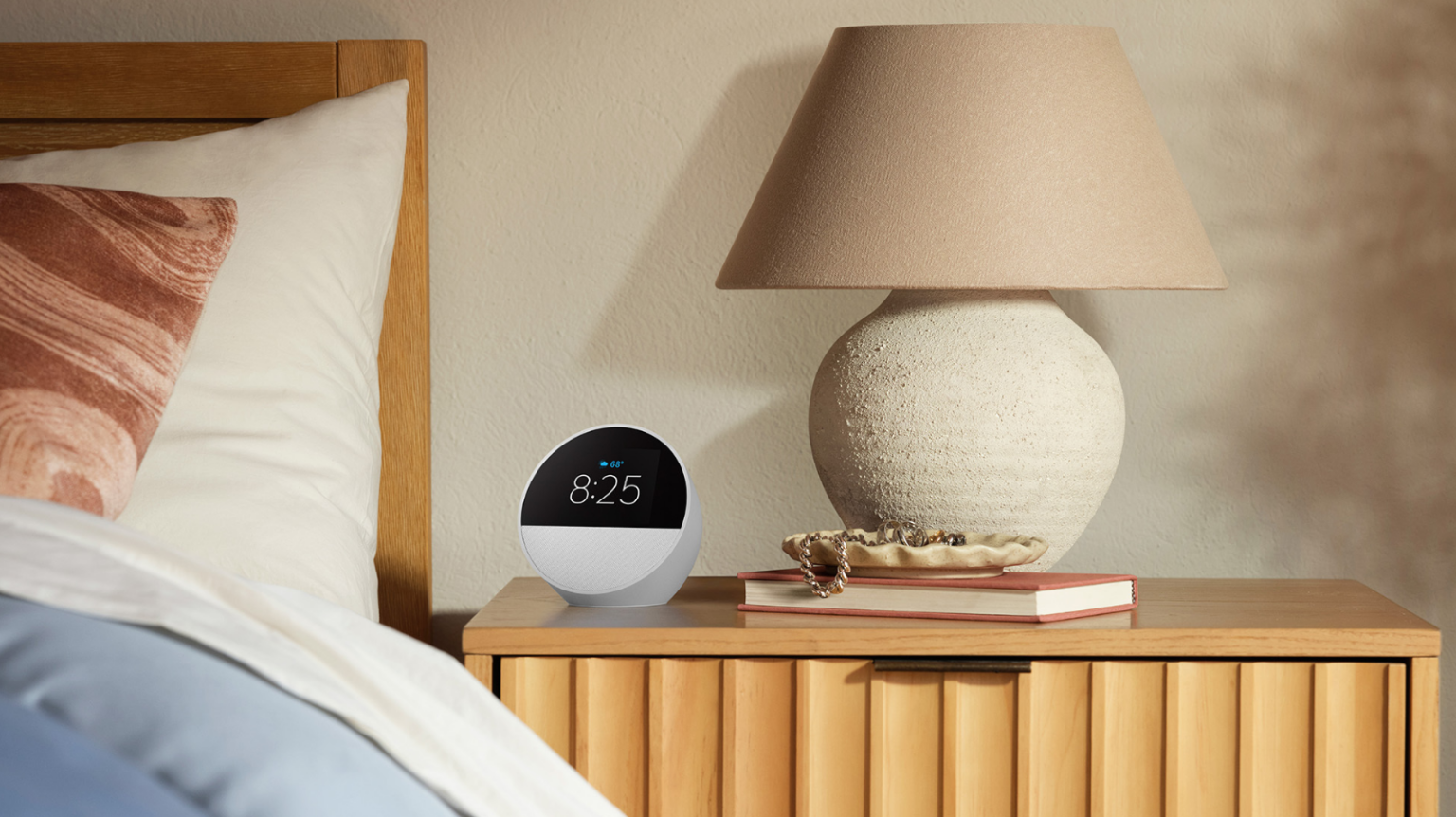 an amazon echo spot on a bedside table