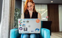 woman sitting on chair using laptop