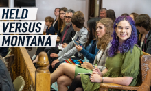 Photograph depicts young people sat in court for the Held v Montana trial. Caption reads "Held versus Montana"