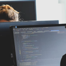 man coding on computer 