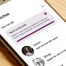 Hinge on phone showing banner on top of chats stating, 'You're at the limit.'
