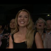 Sydney Sweeney beaming in the audience of Samsung Unpacked 2024.