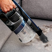 shark pet vacuum handheld cleaning a couch