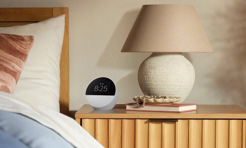 an amazon echo spot on a bedside table