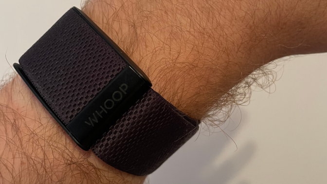 black whoop strap on man's wrist